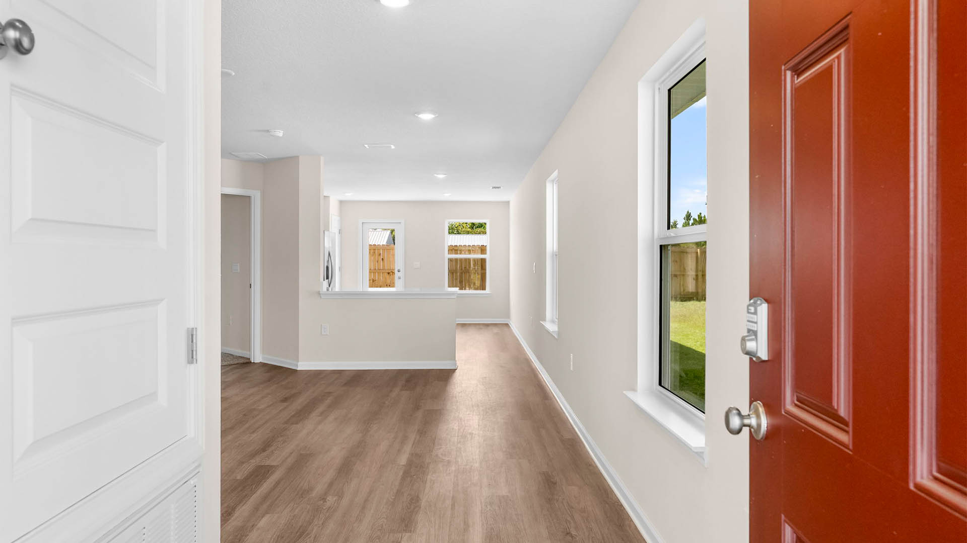 Front door entry into living room with EVP flooring.