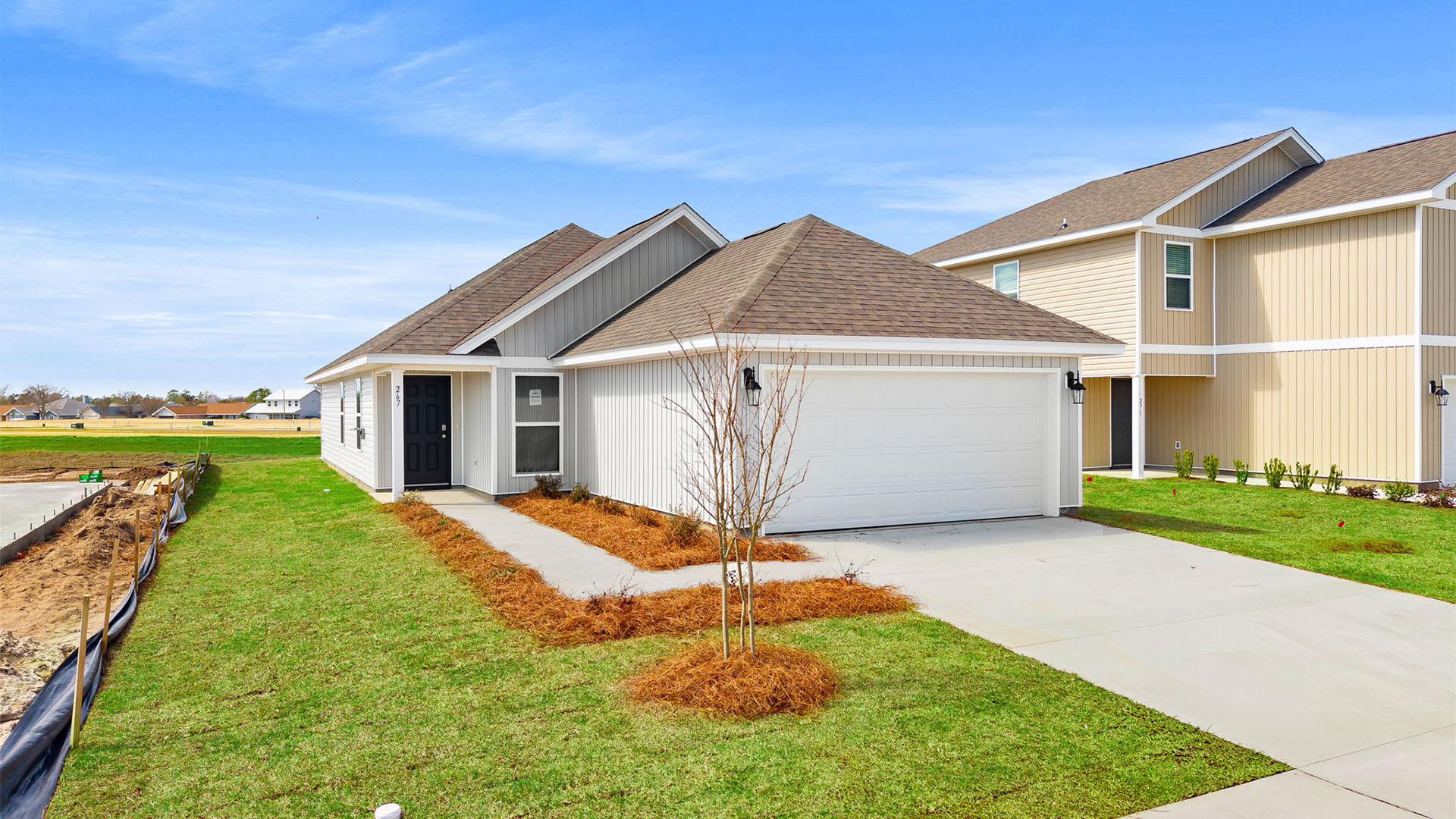Celeste floor plan at Park Place with viny siding and two car garage.
