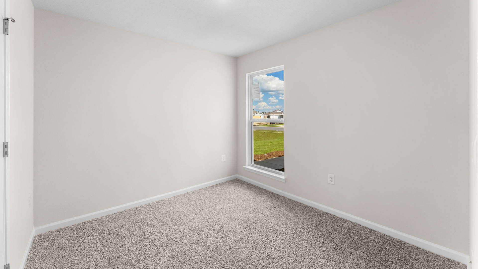 Bedroom with closet and carpet floor and window.