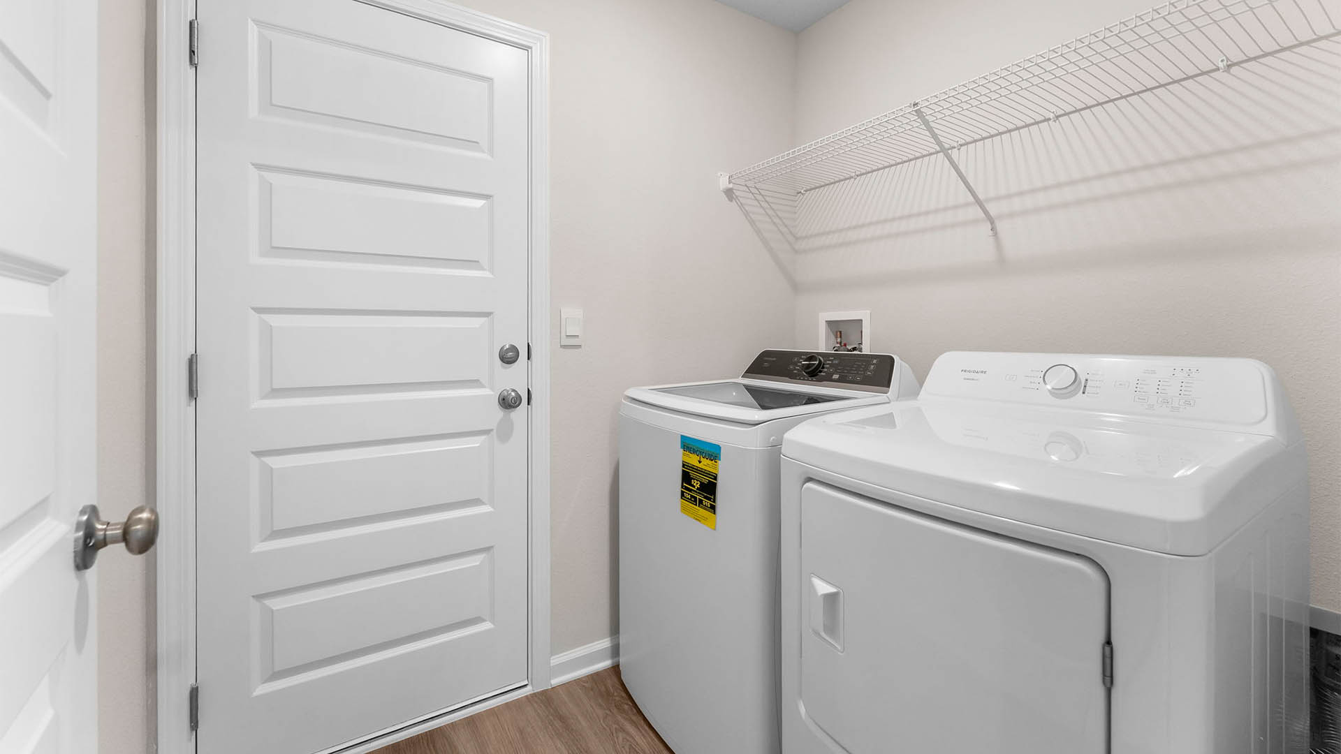 Laundry room with ventilated shelving.
