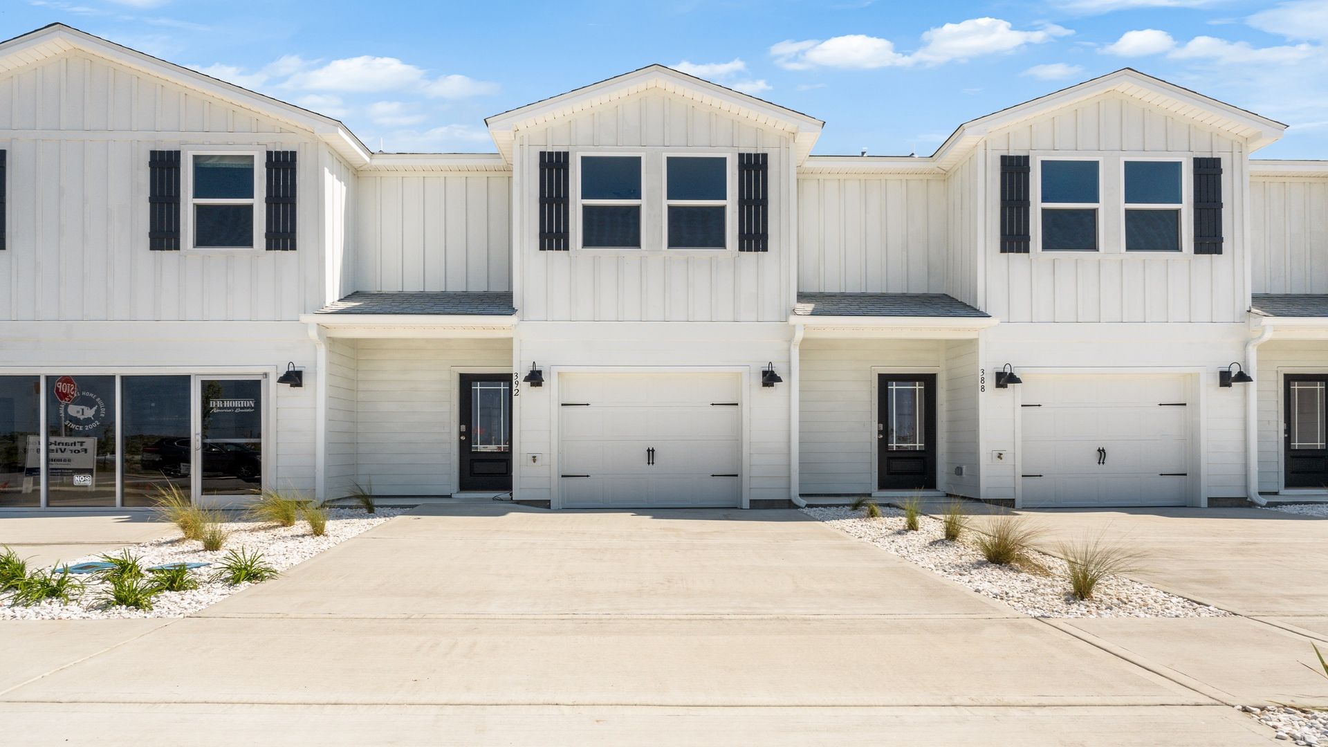 Two-story townhome with single car garage.