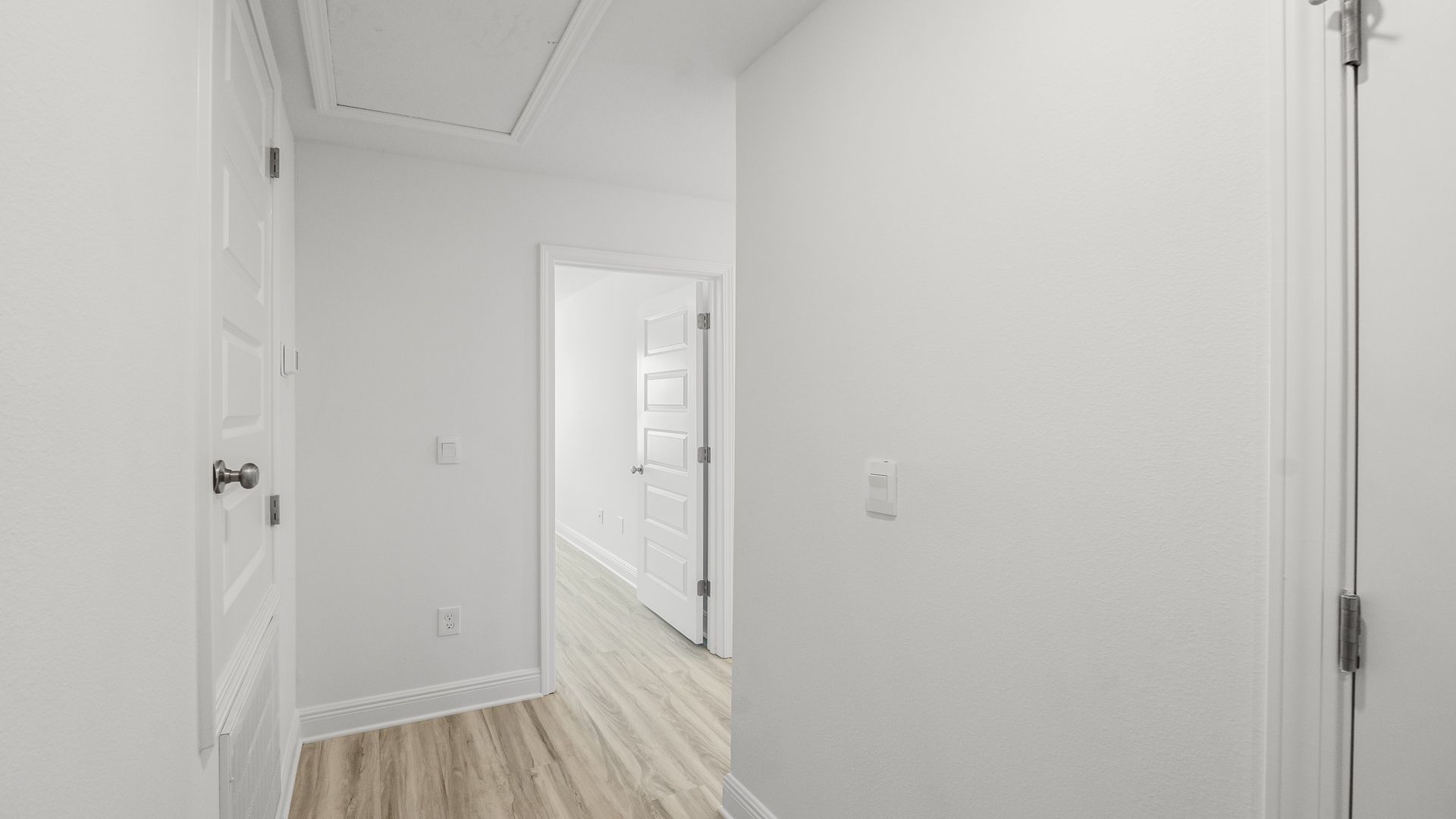 Hallway with bedroom and EVP flooring.