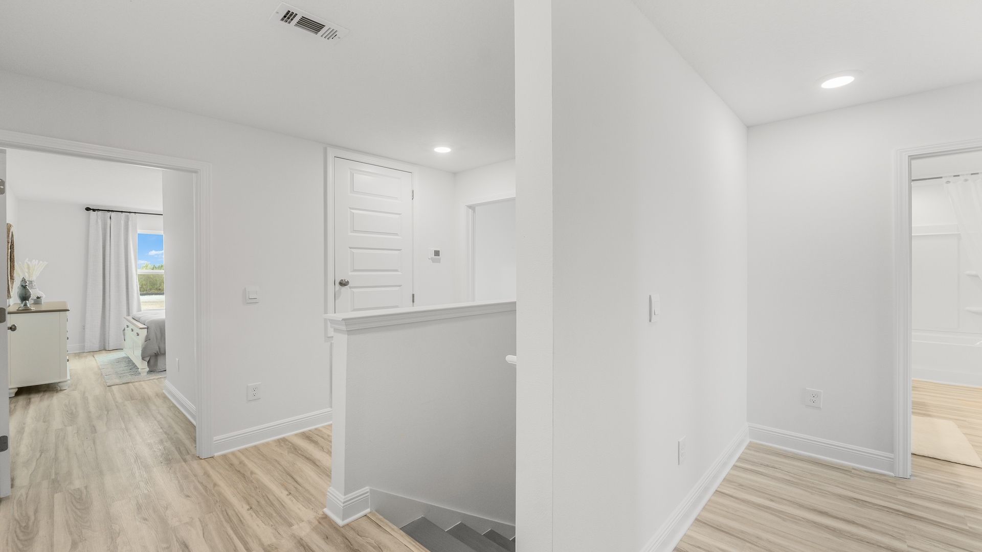 Upstairs foyer showing bedrooms and bathrooms.