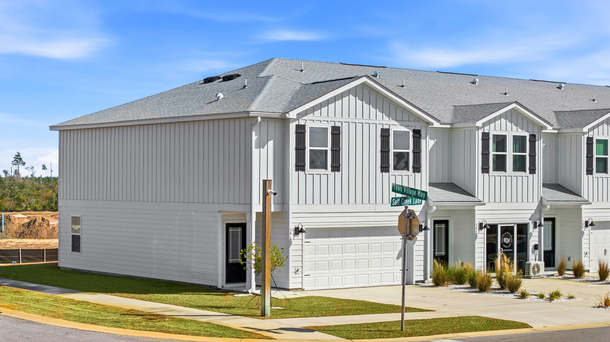Two-Story Sabal townhome with 2-car garage and white Hardie Board siding.
