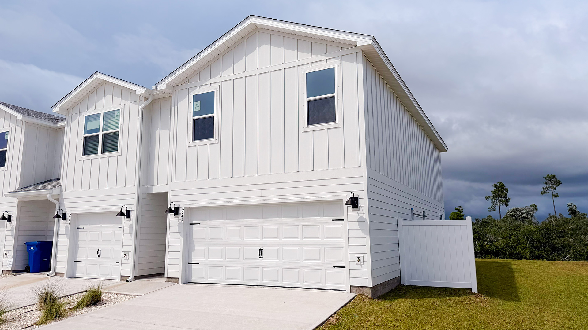Two-Story Sabal townhome with 2-car garage and white Hardie Board siding.