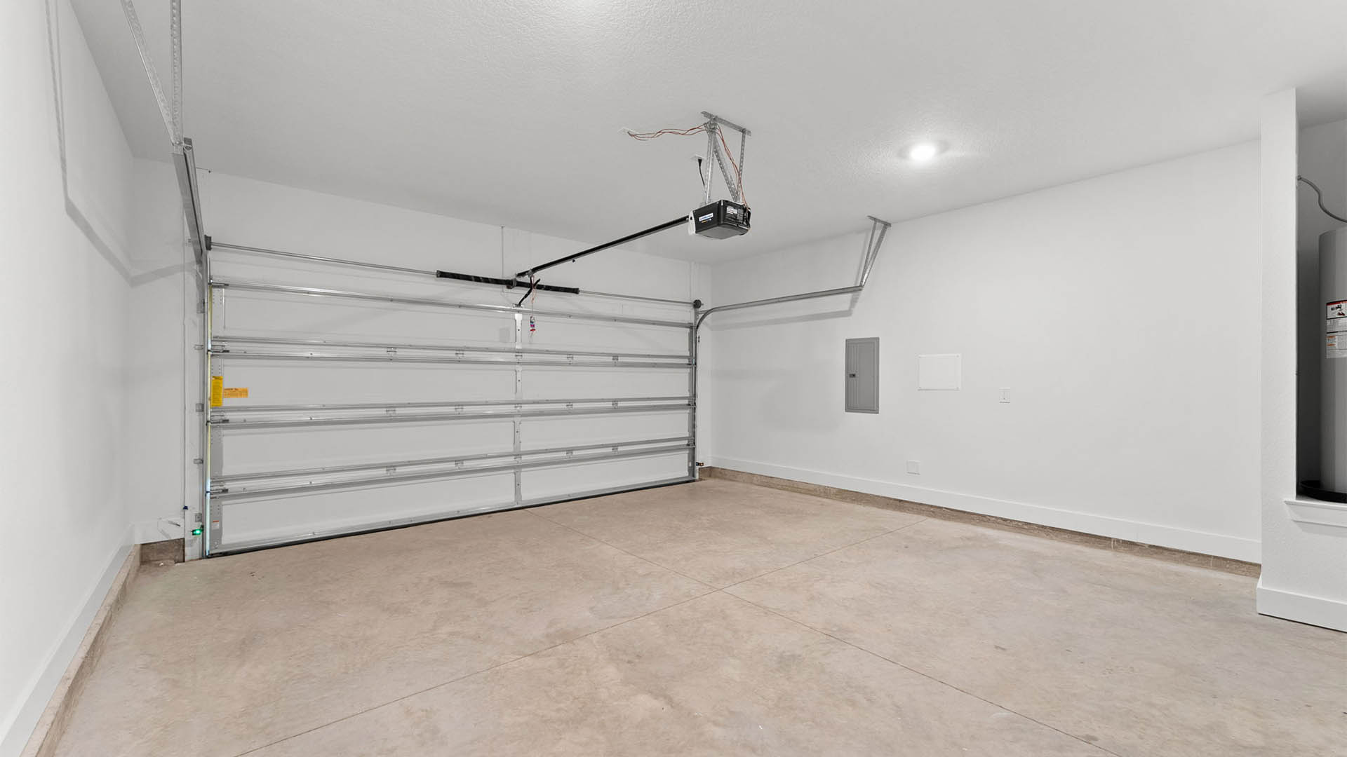 Two car garage with water heater.