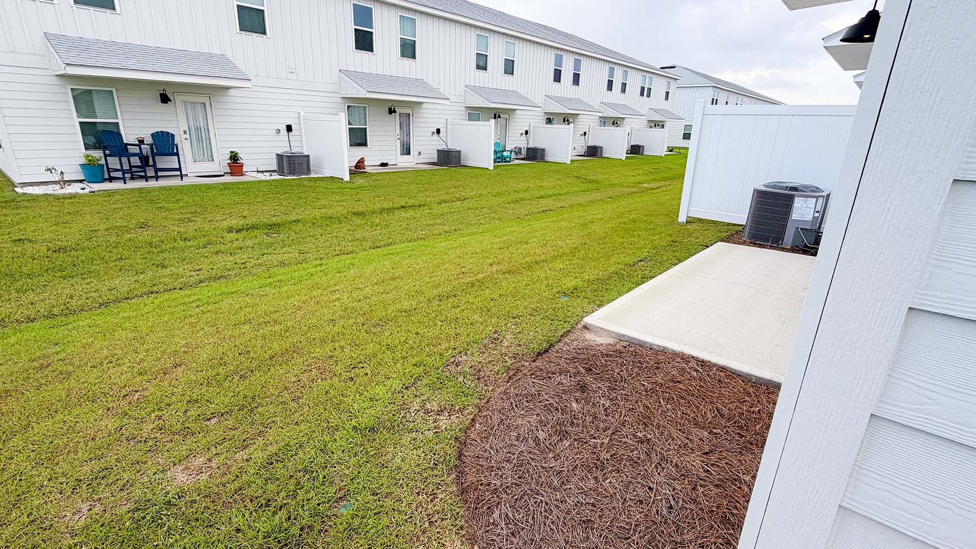 Back yards of townhomes at Salt Creek Townhomes.