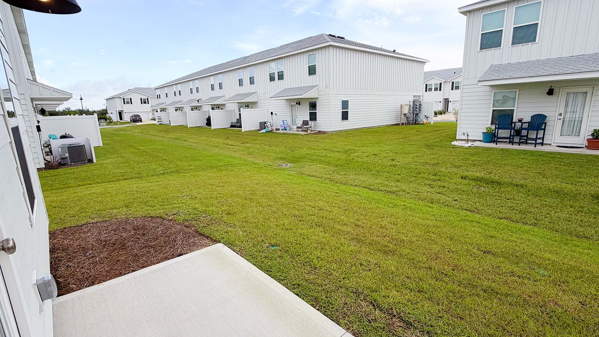 Back yards of townhomes at Salt Creek Townhomes.