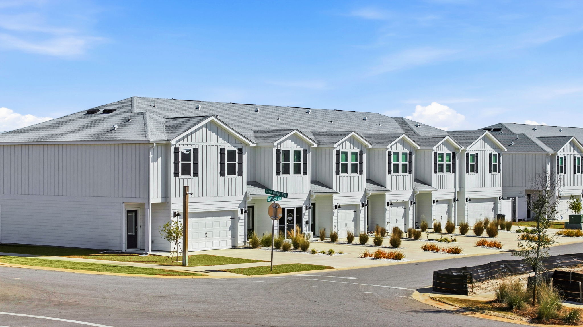 Two-Story Sabal townhome with 2-car garage and white Hardie Board siding.