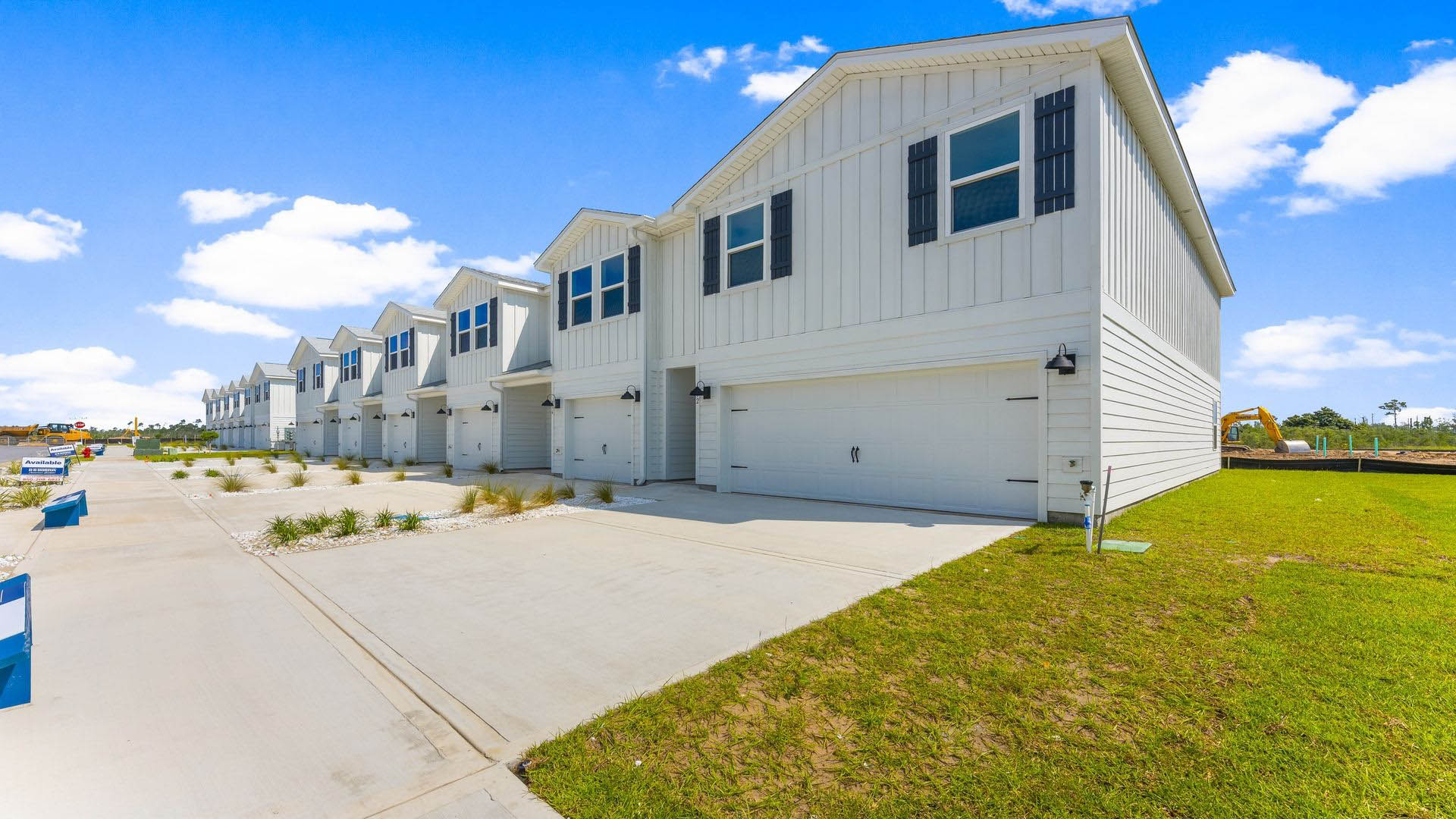 Two-Story Sabal townhome with 2-car garage and white Hardie Board siding.