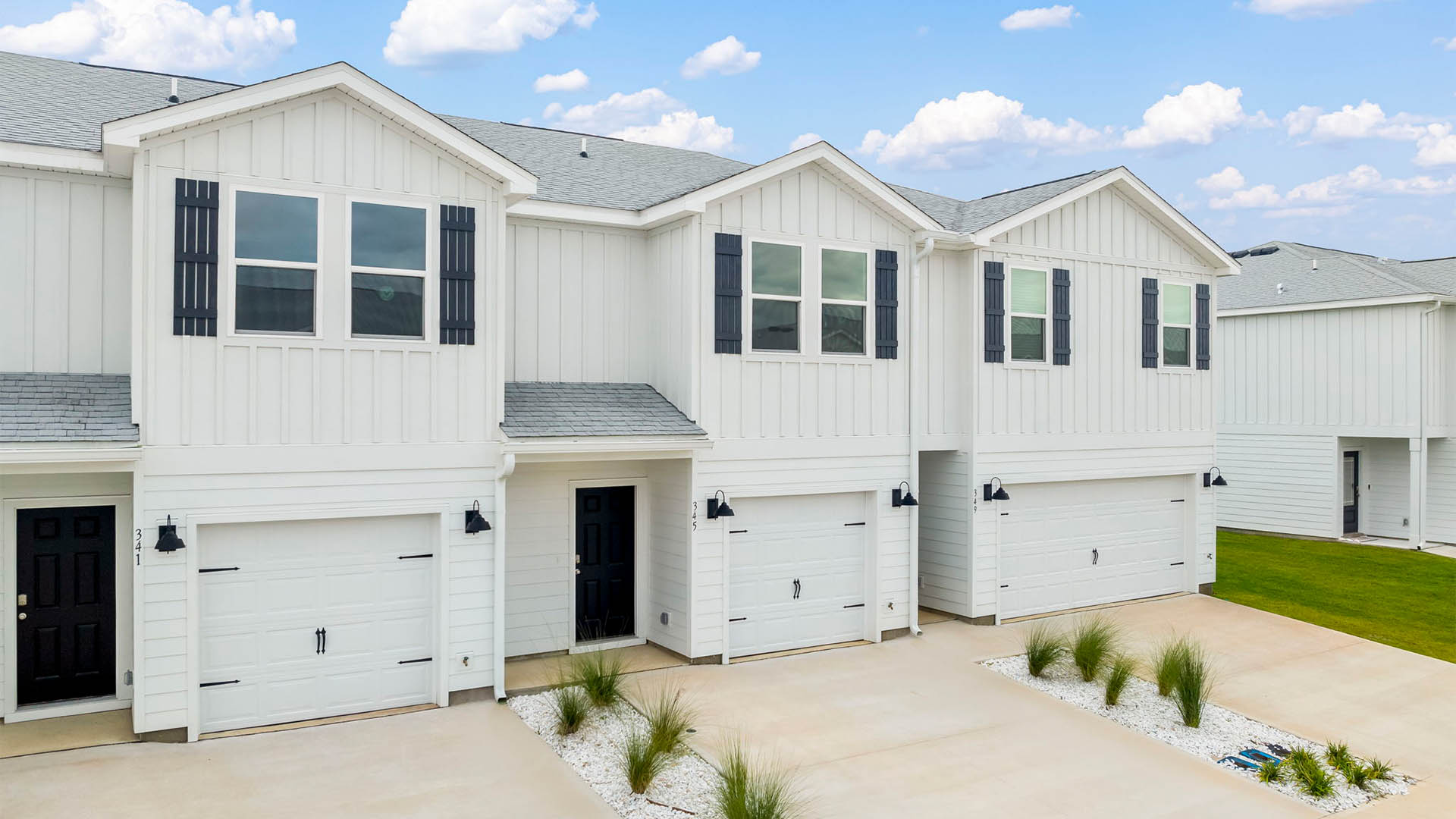 Sabal townhome with single car garage and Hardie siding.