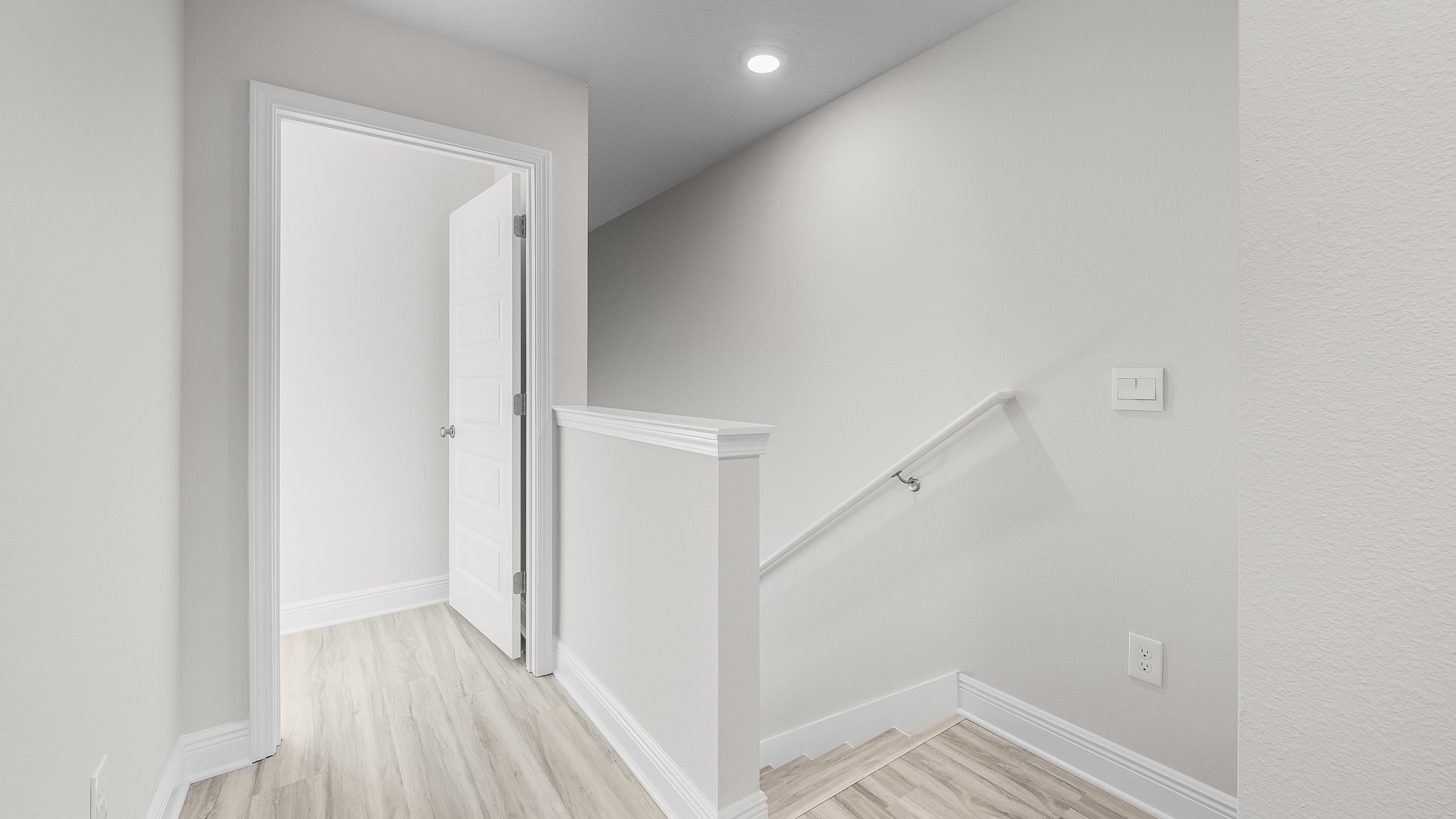 Upstairs foyer showing bedrooms and bathrooms.