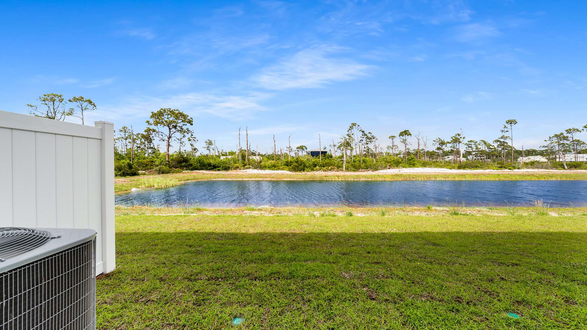 Covered rear patio view looking at pond.