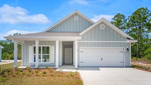 Delray floor plan at Buffer Farms with covered front porch and two car garage and Hardie board siding.