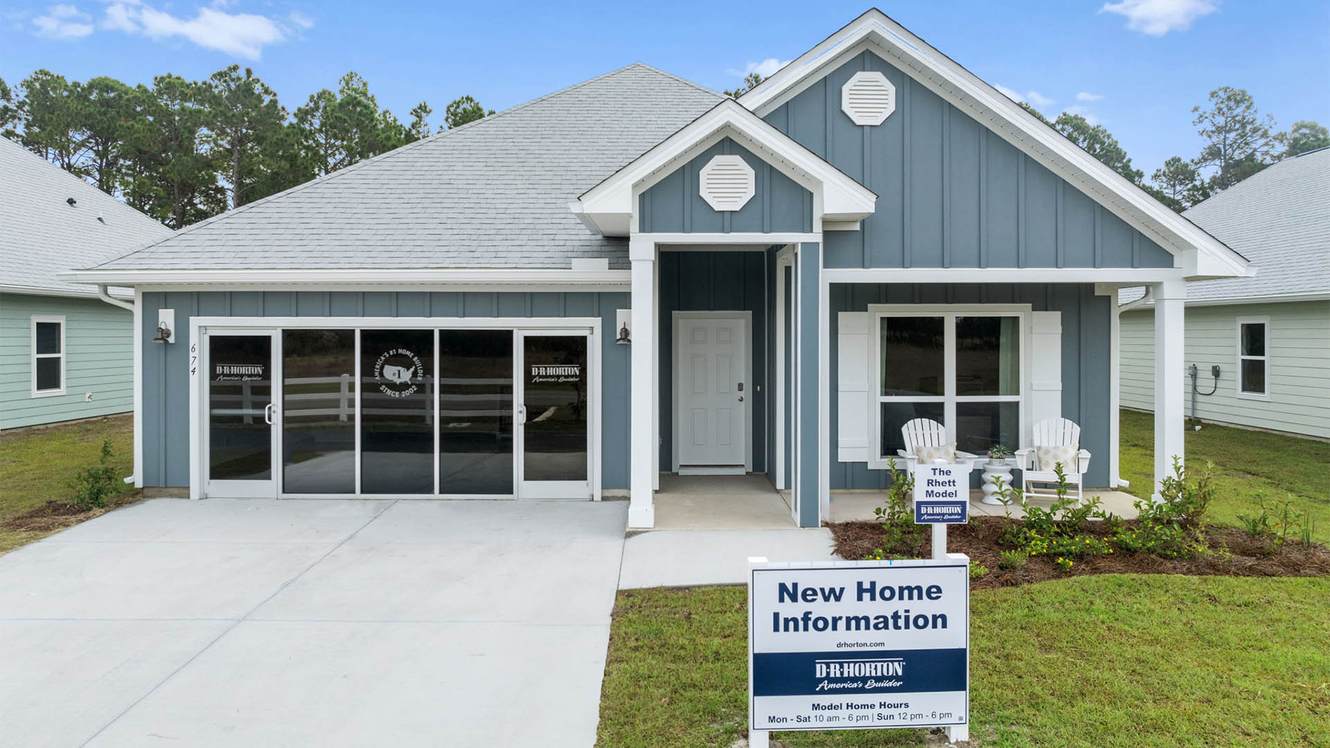 Rhett floor plan at Buffer Farms with Hardie Board siding and two-car garage and covered front porch.