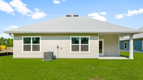 Rhett floor plan at Buffer Farms rear of home with covered back patio and back yard.