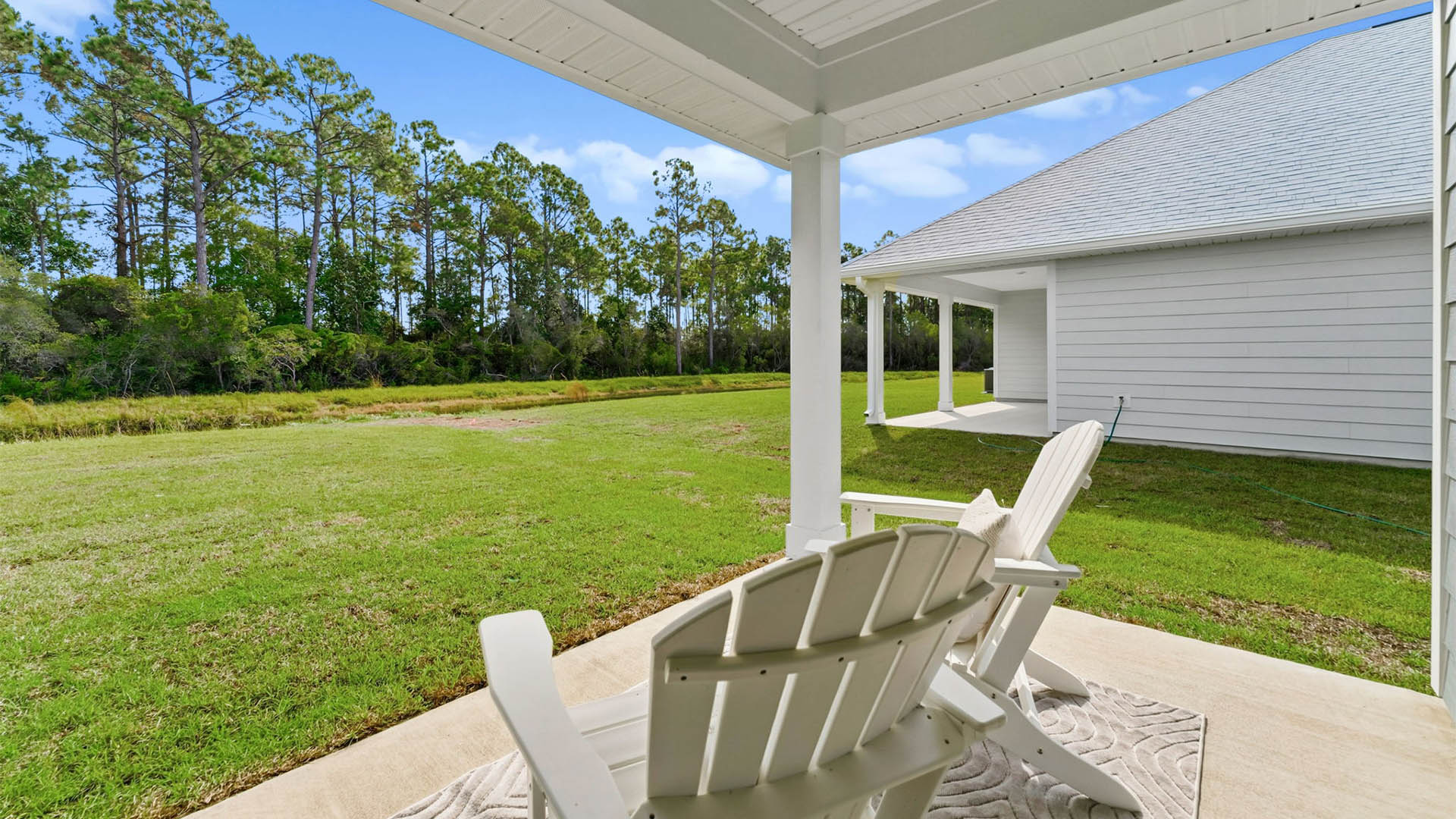 Covered back patio view and back yard.