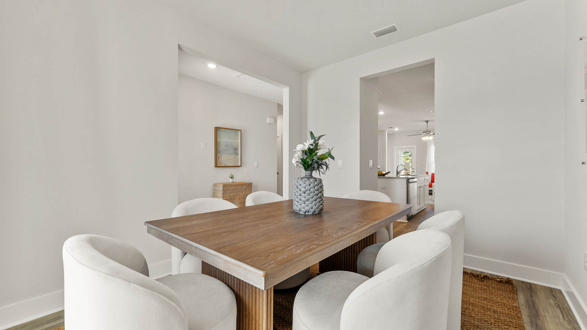 Dining room and kitchen entryway and front door entrance.
