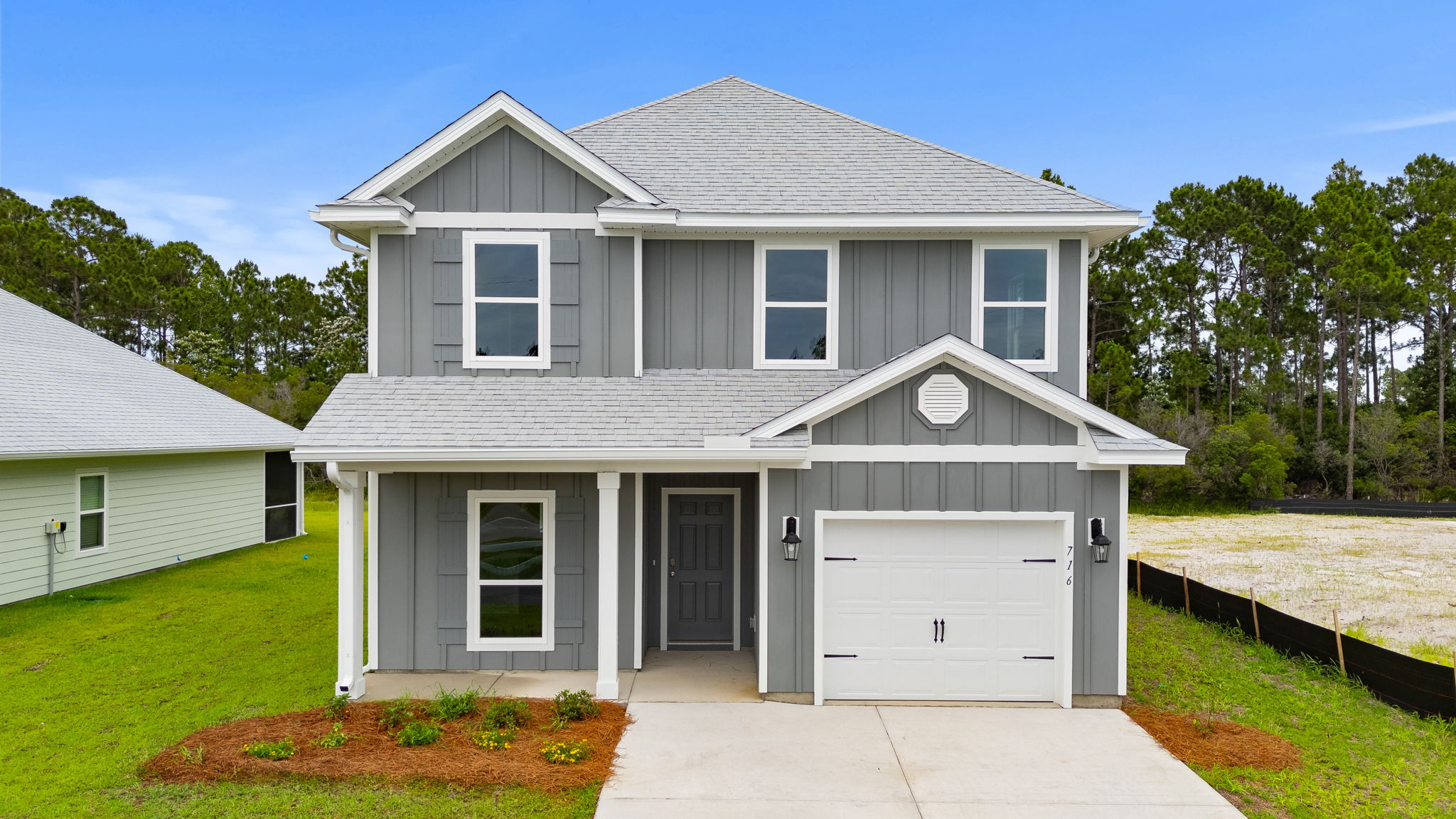 Alabaster floor plan at Buffer Farms with Hardie siding and covered front porch and single car garage.
