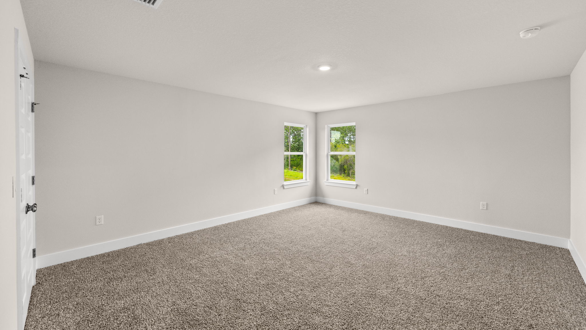 Upstairs common area with windows.
