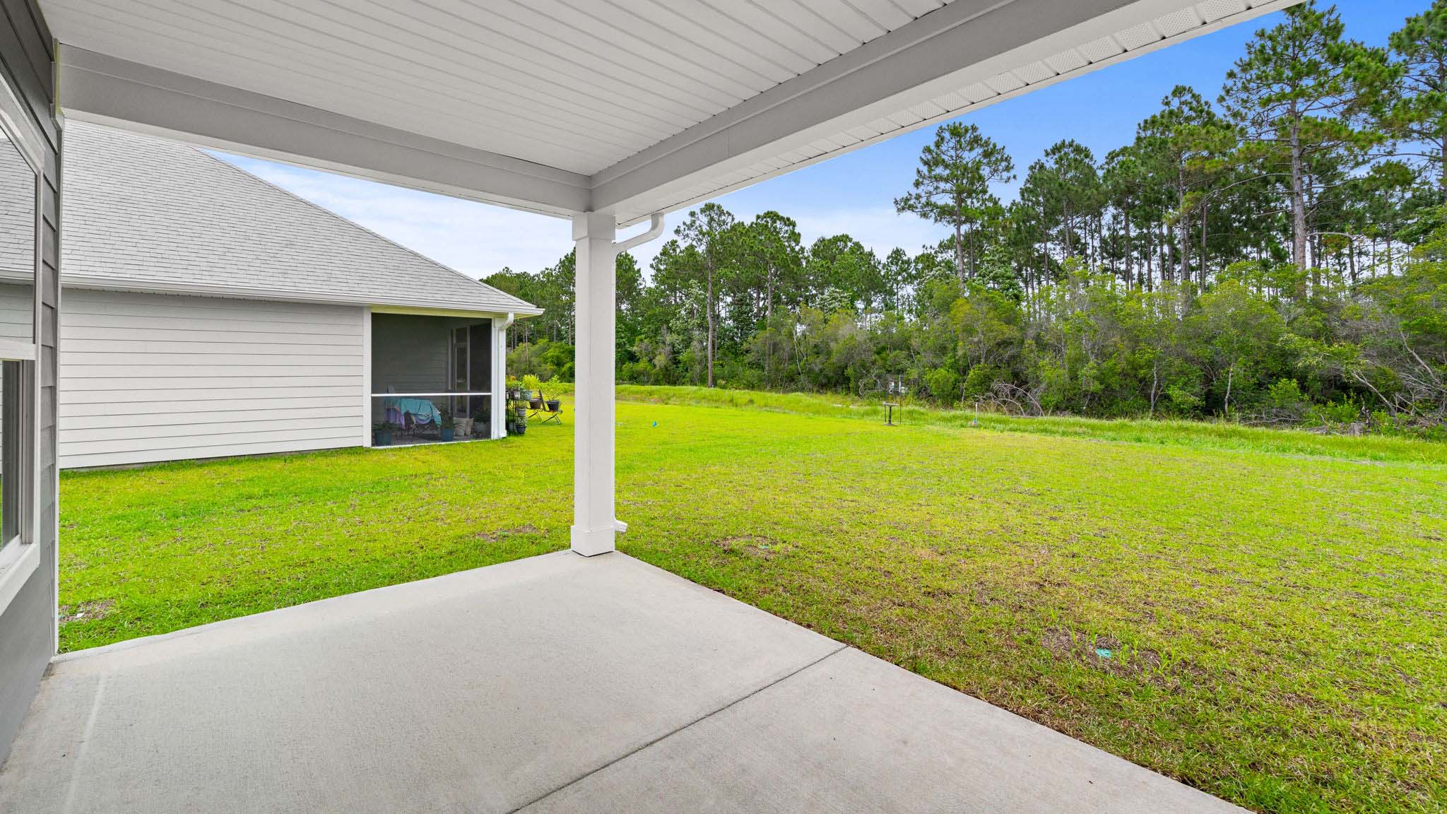 Covered rear patio of Alabaster floor plan at Buffer Farms.