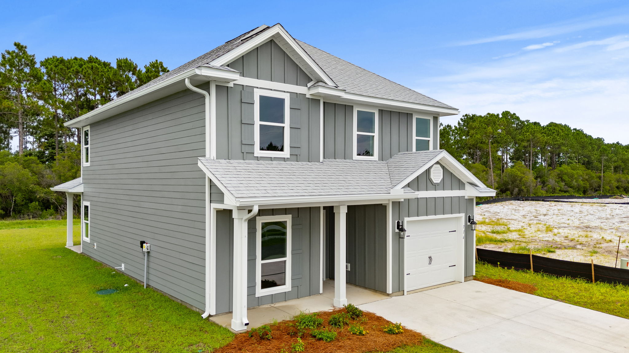 Alabaster floor plan at Buffer Farms with Hardie siding and covered front porch and single car garage.