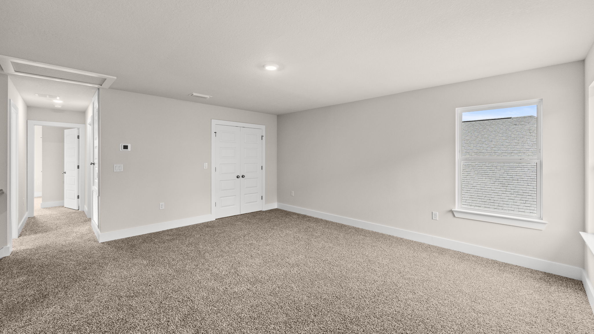Upstairs common area with windows.