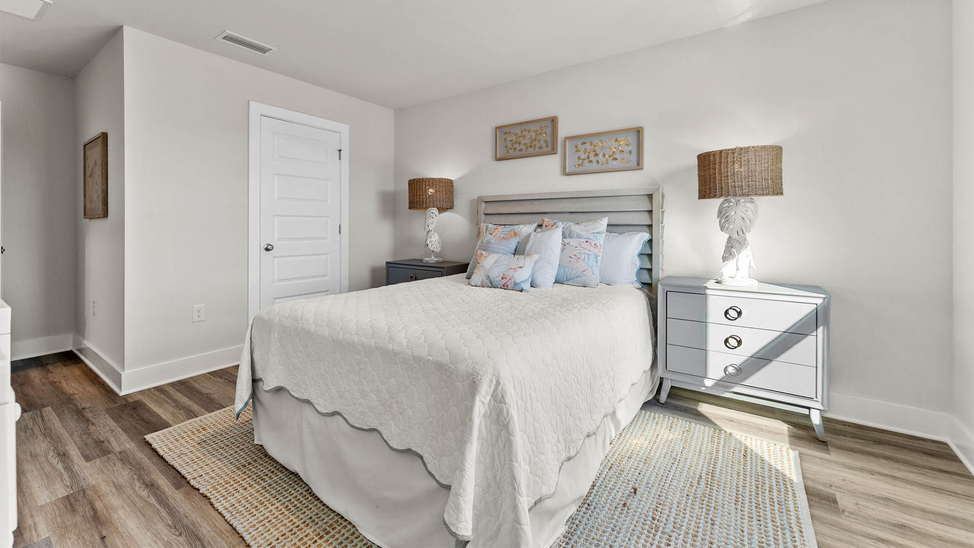 Bedroom with EVP flooring and closet.