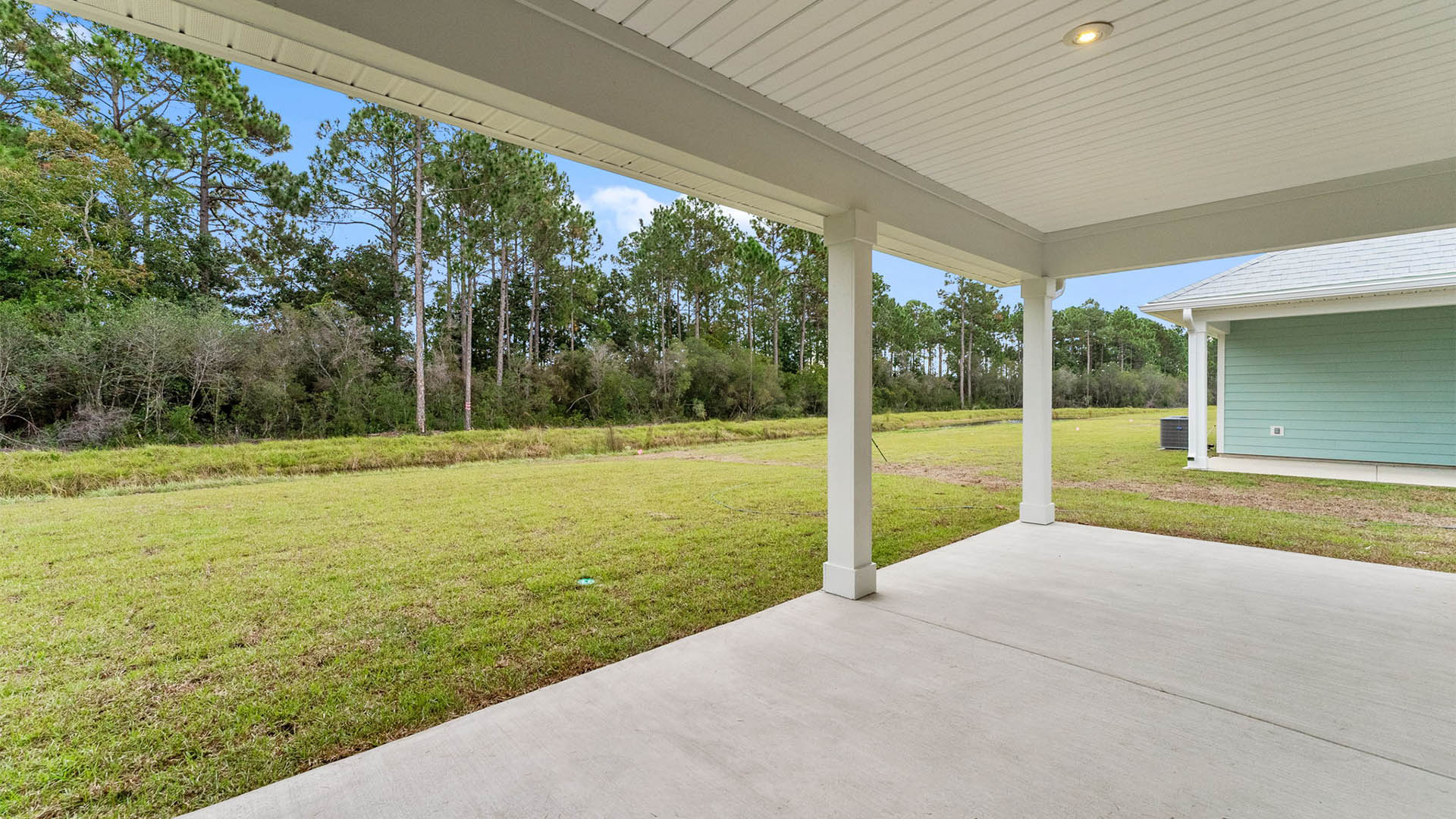 Covered rear porch view and back yard.