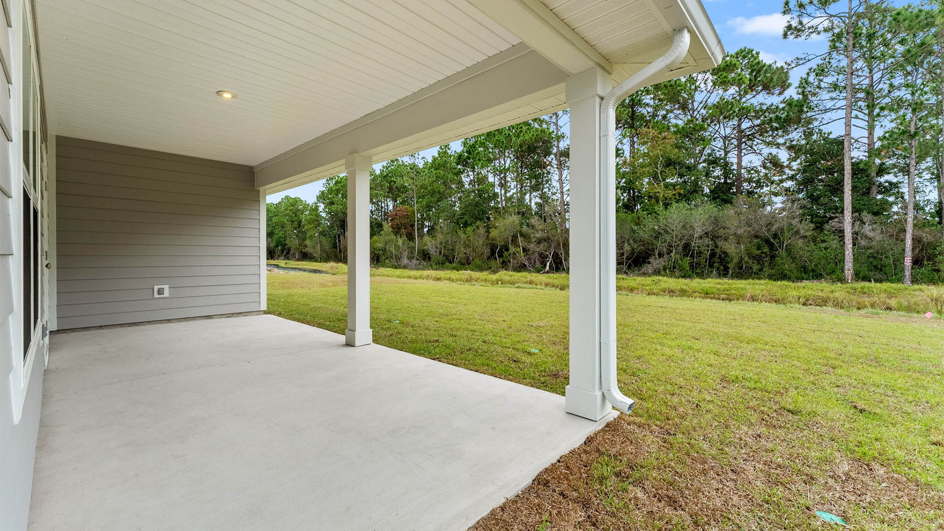 Covered rear porch view and back yard.