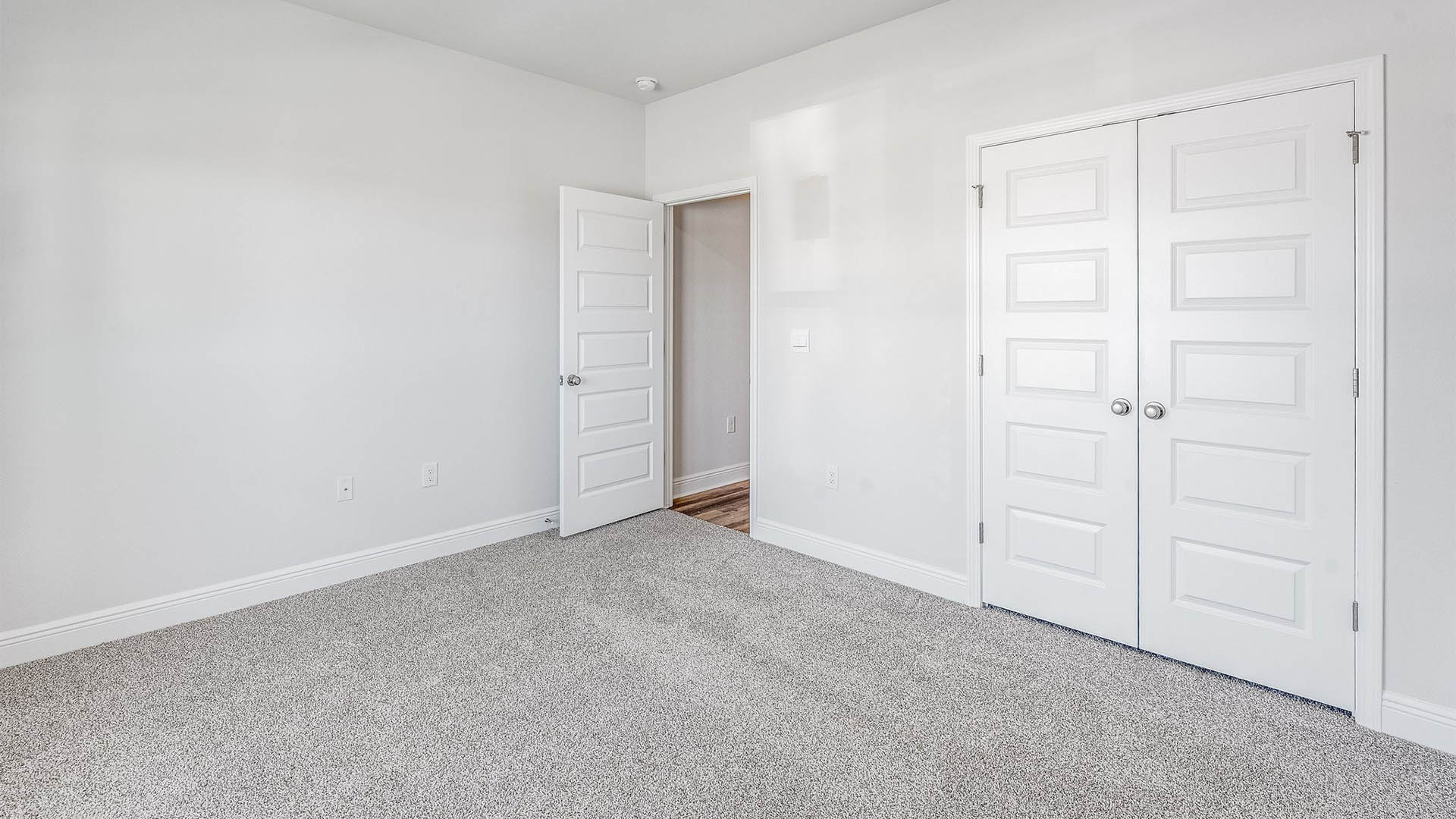 Bedroom with carpet floors and closet.