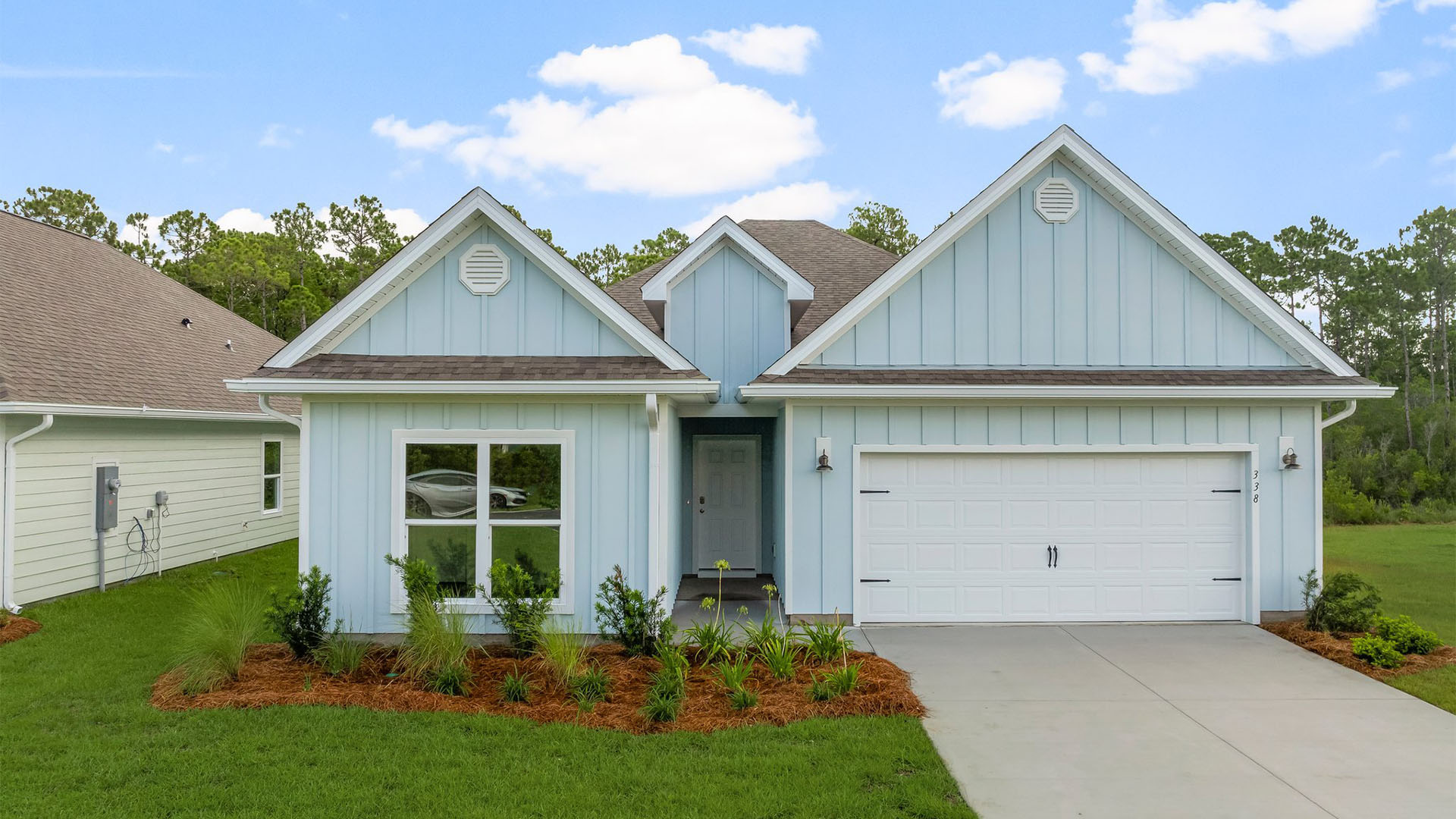 Kennedy floor plan at Buffer Farms with two-car garage and Hardie Board siding.