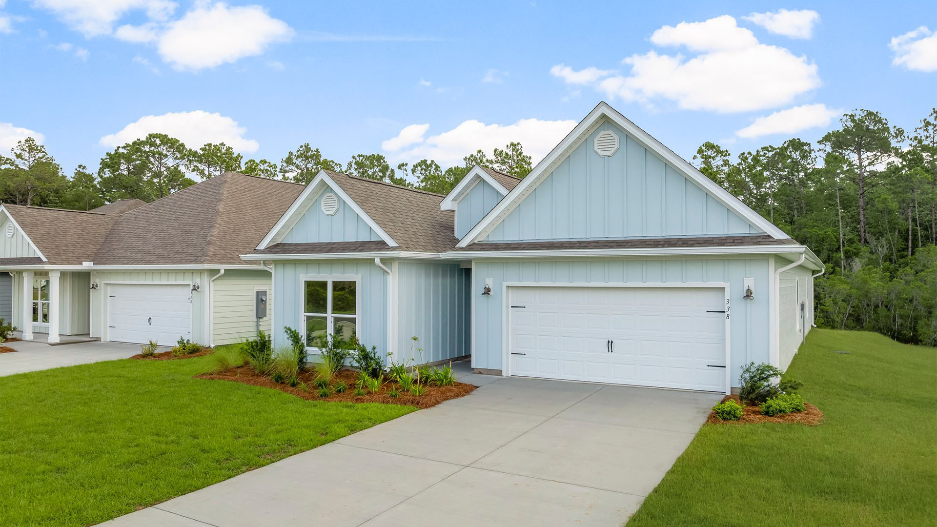 Kennedy floor plan at Buffer Farms with two-car garage and Hardie Board siding.