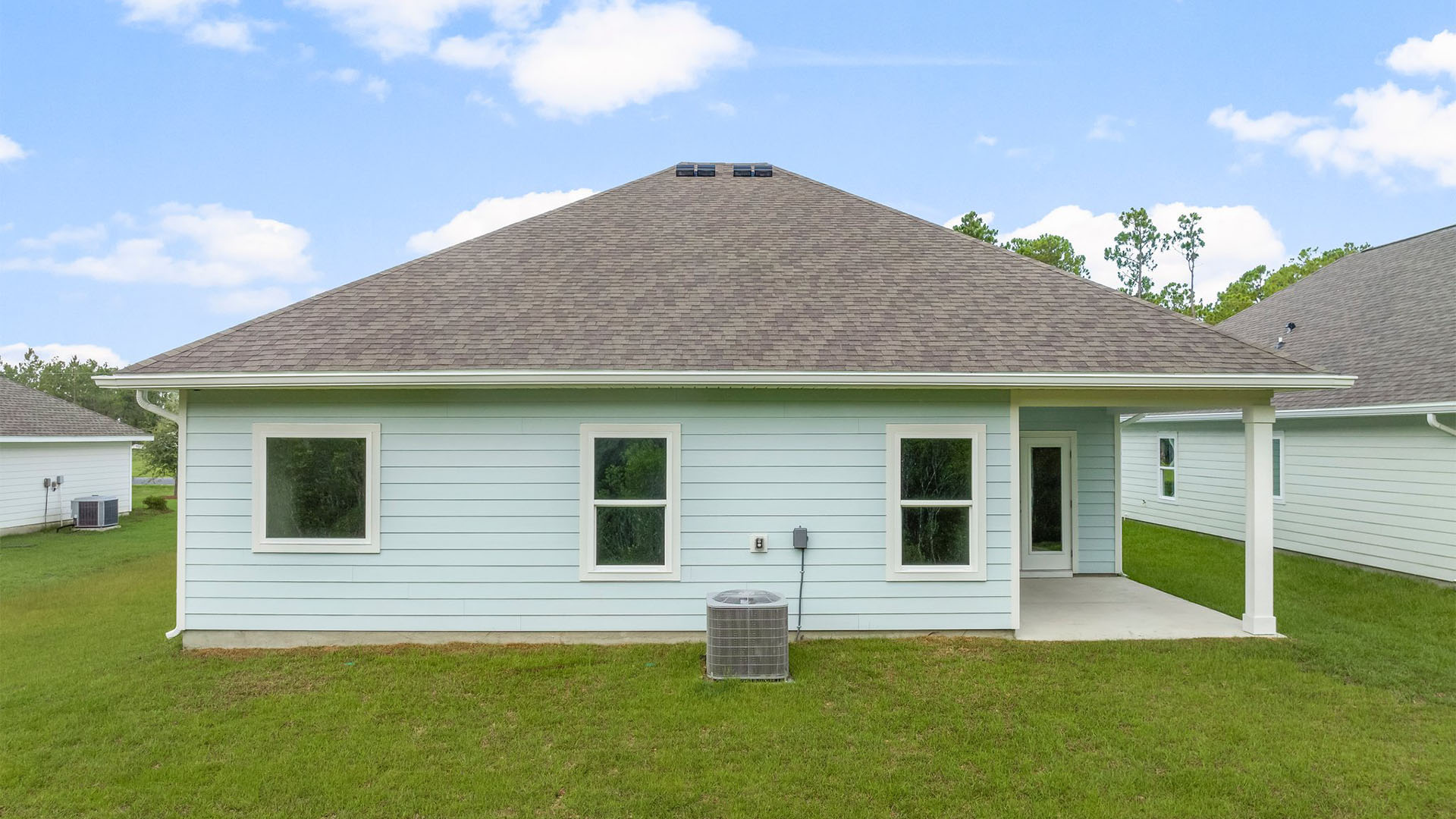 Kennedy floor plan at Buffer Farms rear of home with covered back patio and back yard.