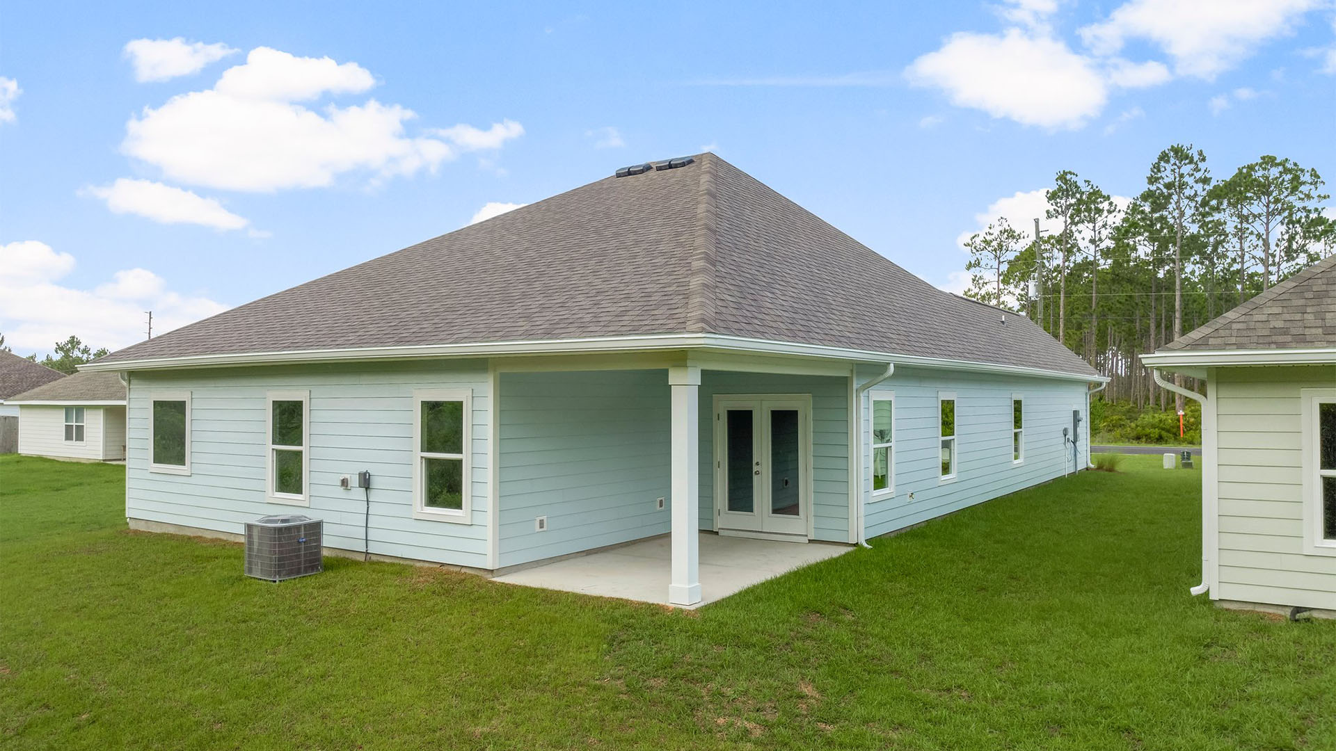 Kennedy floor plan at Buffer Farms rear of home with covered back patio and back yard.