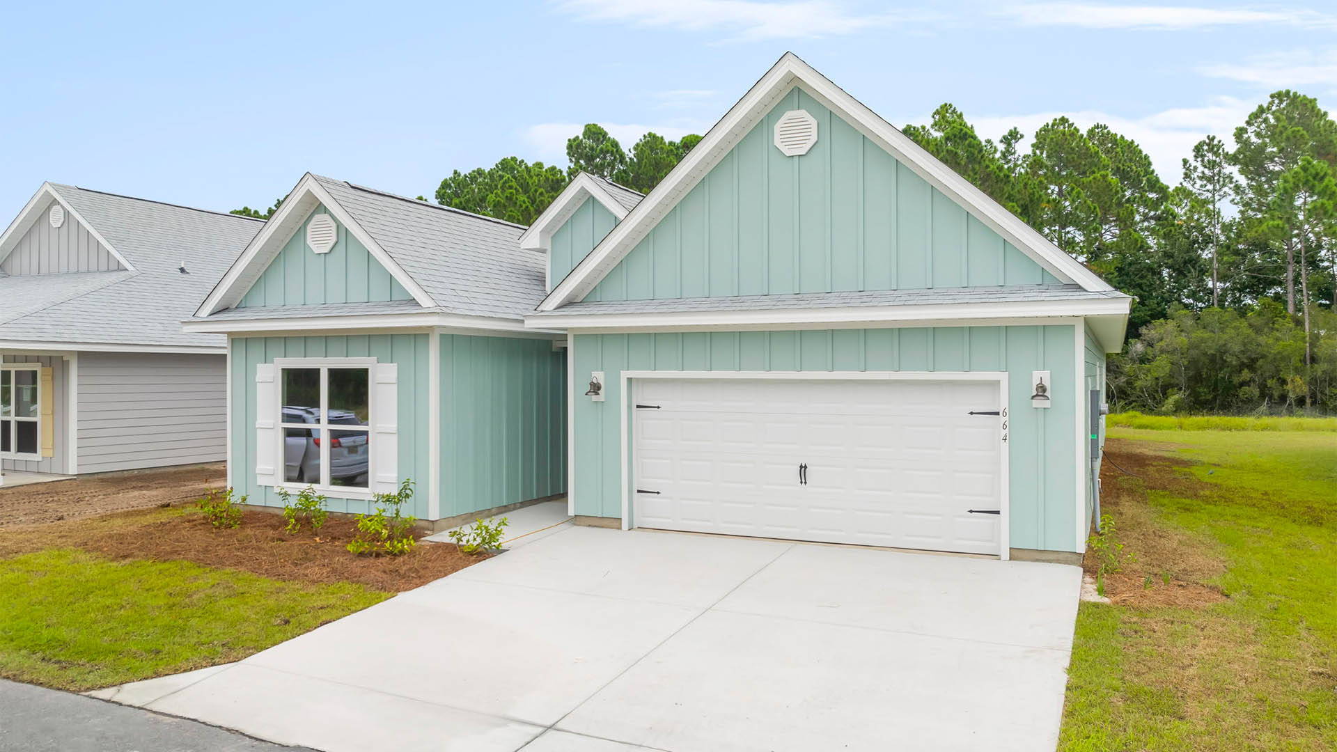 Kennedy floor plan at Buffer Farms with two-car garage and Hardie Board siding.