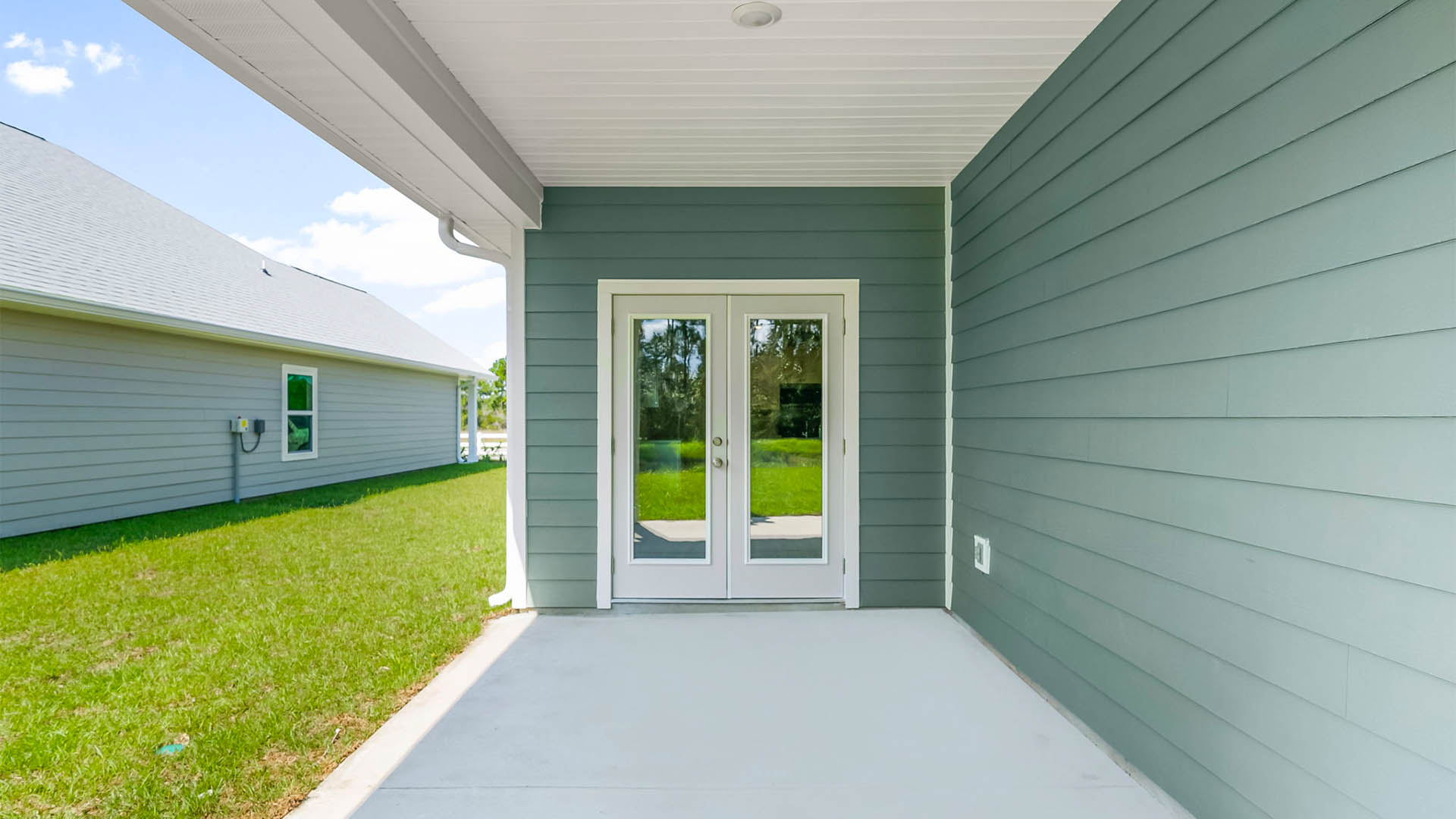 Covered back patio view and back yard.