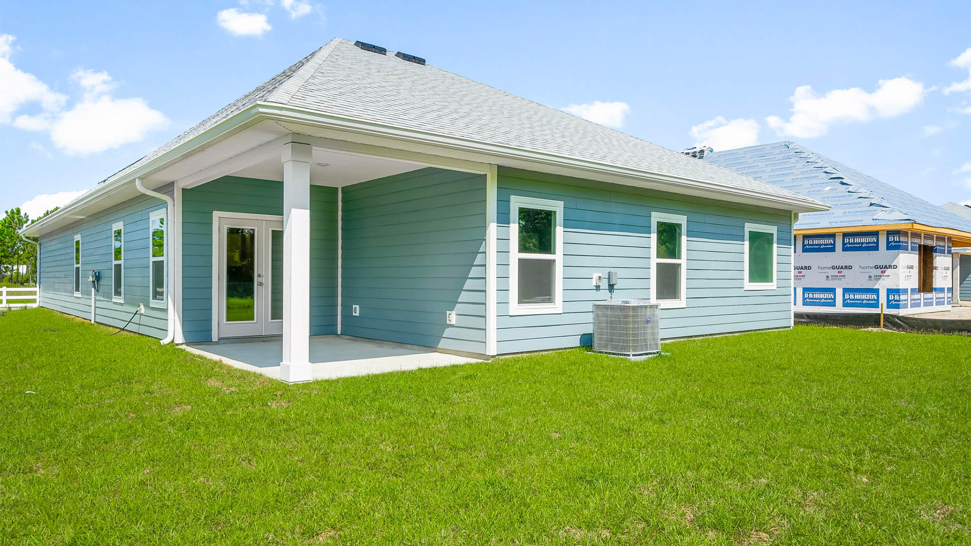 Kennedy floor plan at Buffer Farms rear of home with covered back patio and back yard.