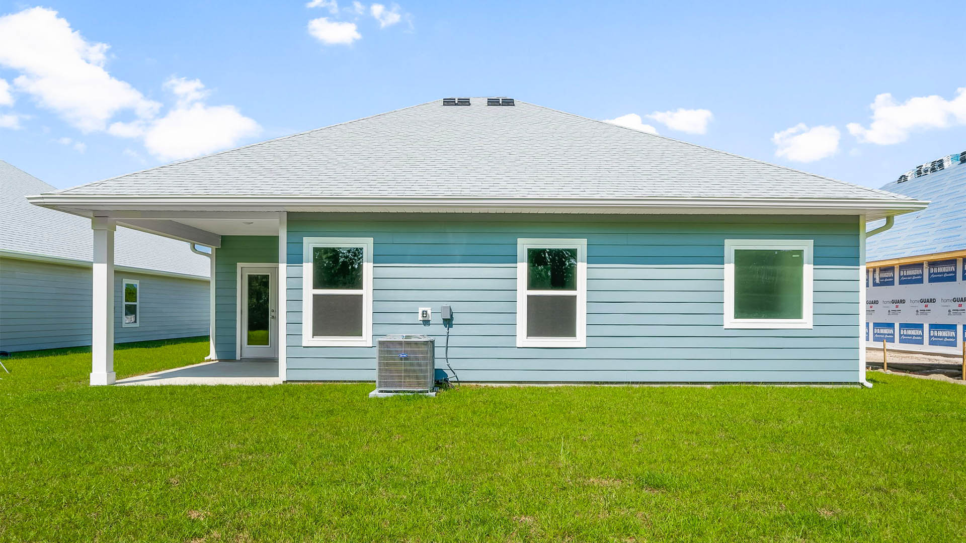 Kennedy floor plan at Buffer Farms rear of home with covered back patio and back yard.
