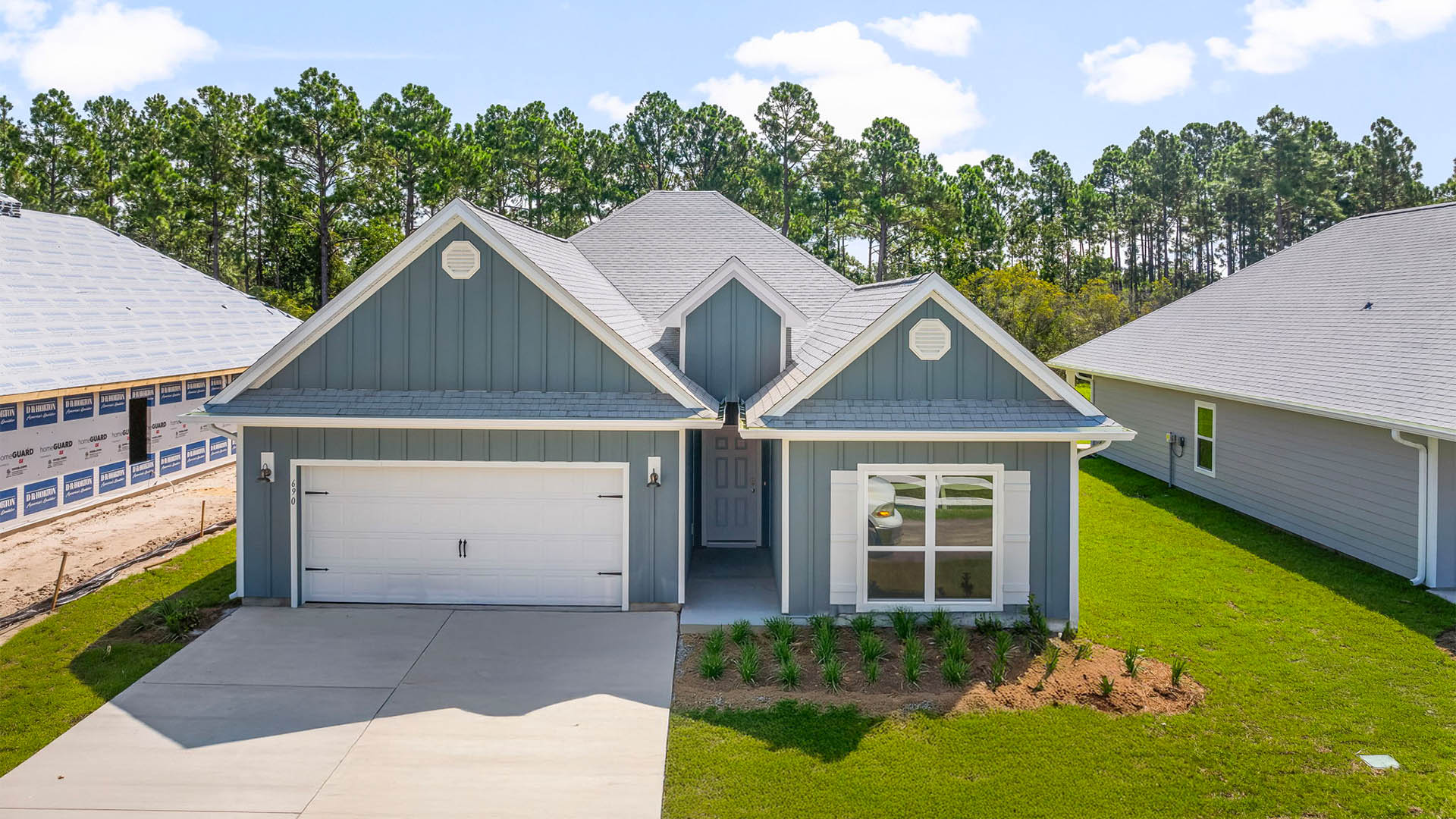 Kennedy floor plan at Buffer Farms with two-car garage and Hardie Board siding.