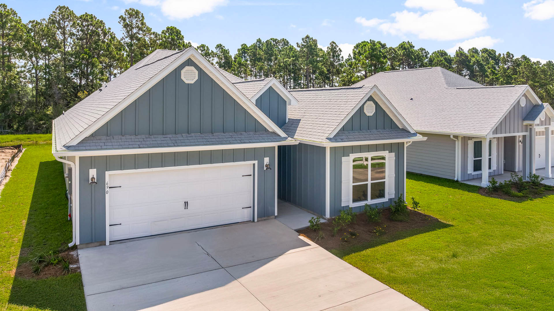 Kennedy floor plan at Buffer Farms with two-car garage and Hardie Board siding.