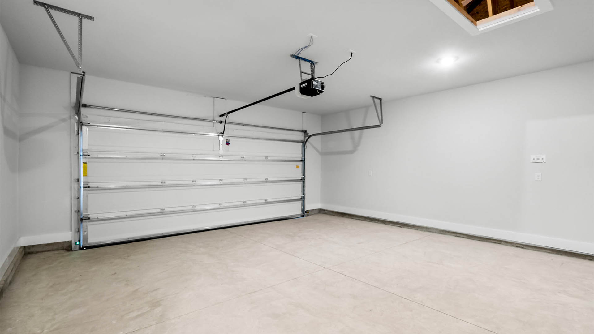 Two-car garage with attic space.