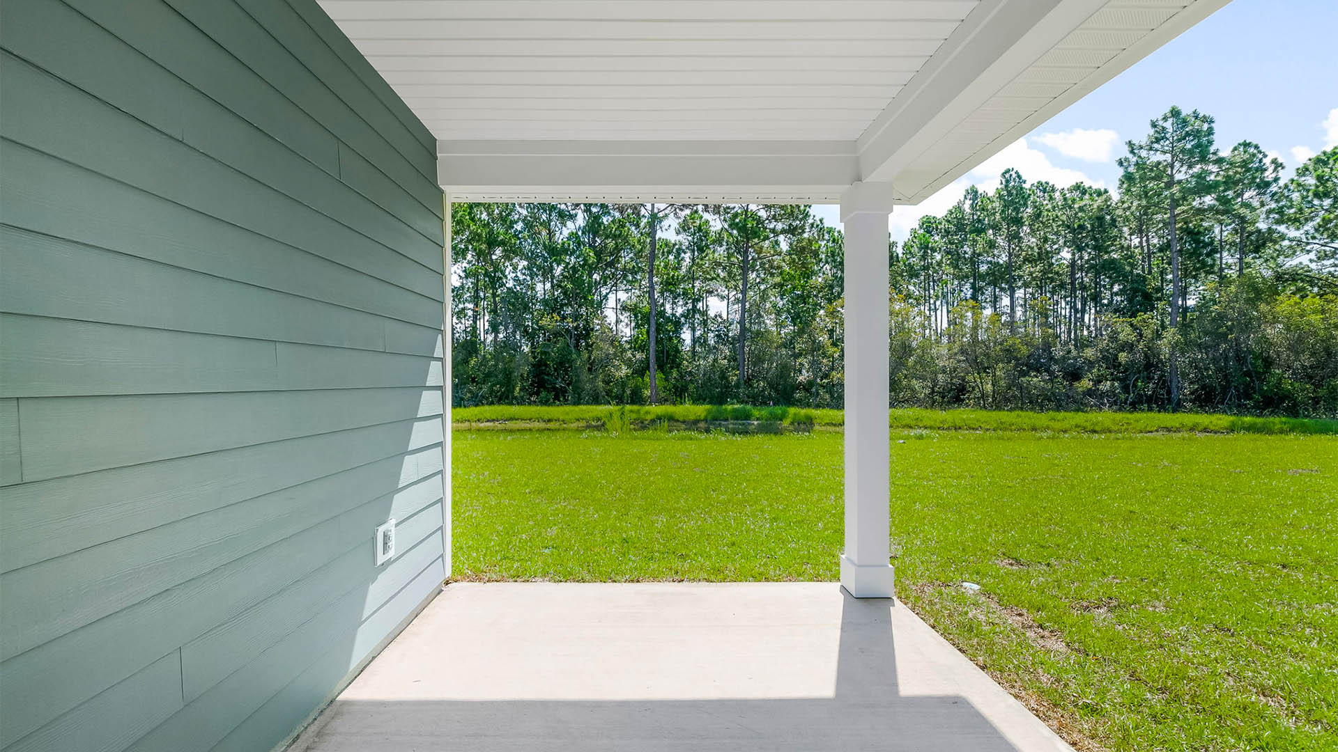 Covered back patio view and back yard.