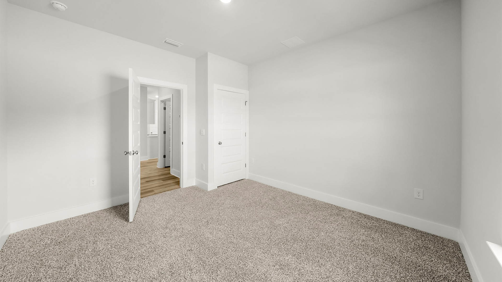 Bedroom with carpet floor and closet.