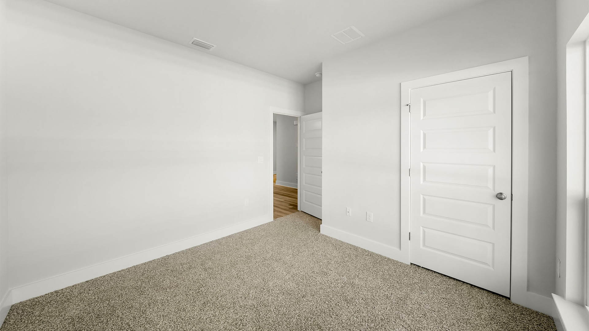 Bedroom with carpet floor and closet.