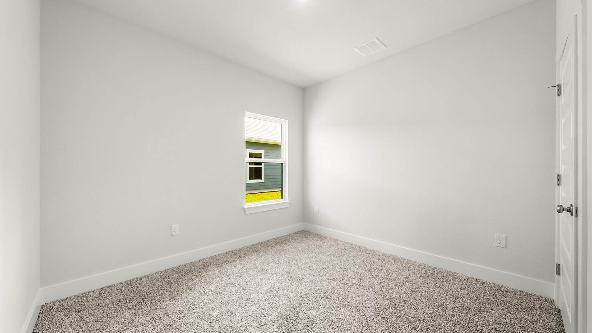 Bedroom with carpet floor and window and closet.