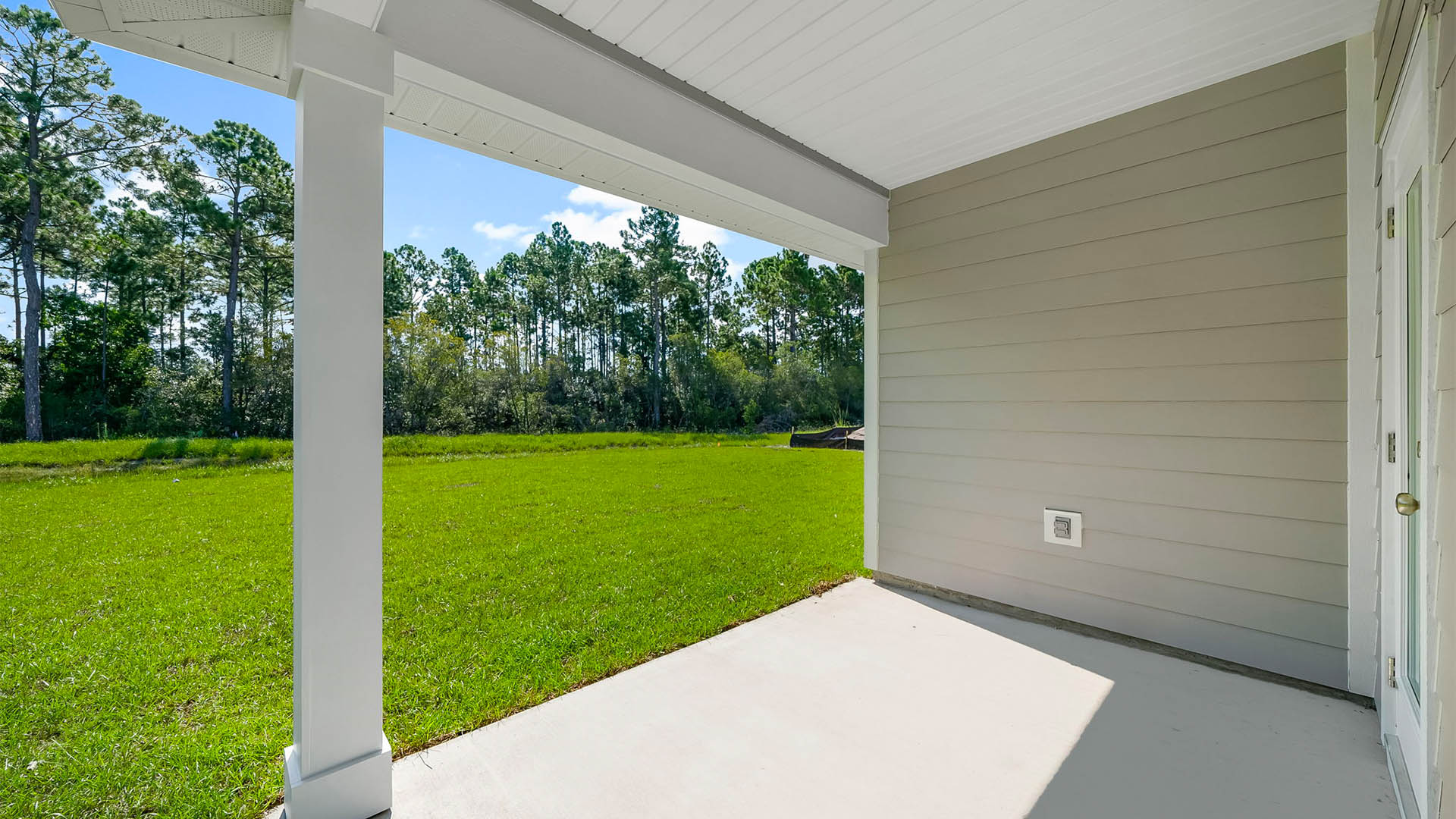Covered back patio view and back yard.