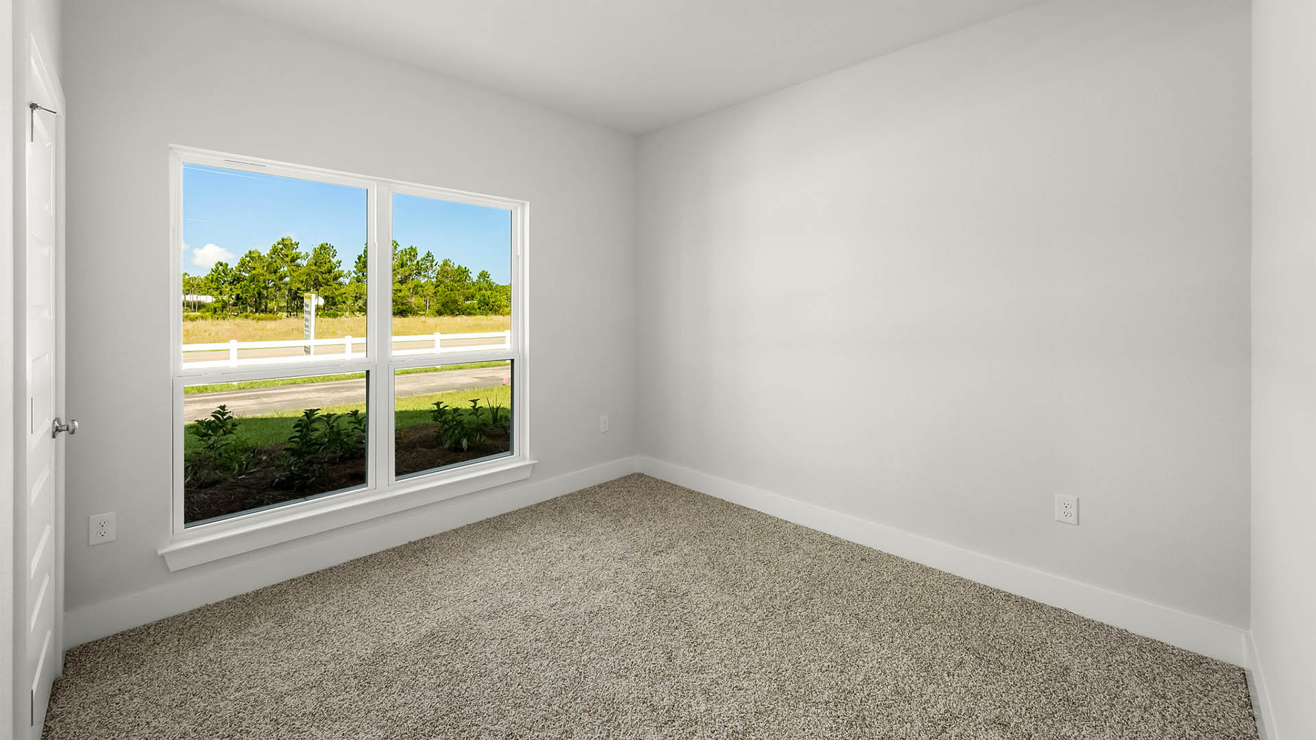 Bedroom with carpet floor and window and closet.