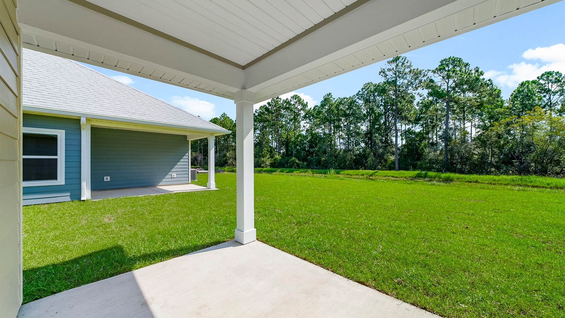 Covered back patio view and back yard.