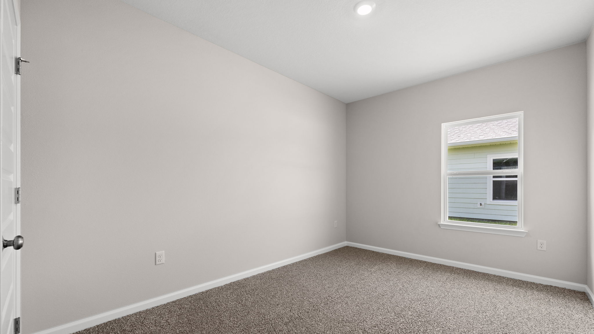 Bedroom with carpet floor and window and closet.